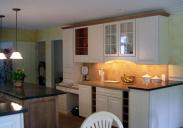 Undercabinet lighting really highlights the countertops installed by Drumm Design Remodel