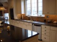 A terrific new tile backsplash and granite countertops make this kitchen gorgeous