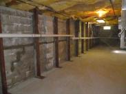 A view of the new support posts that keep this wall from collapsing