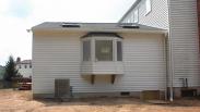 A new bay window is installed in the addition