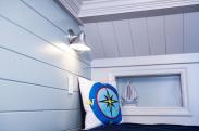 Cool wood specialty storage features and lighting with outlets for charging make this room unique thanks to Drumm Design Remodel