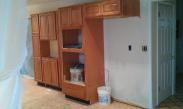 Kitchen cabinets and doors installed.