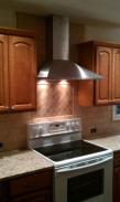 Stainless range hood and new oven installed.