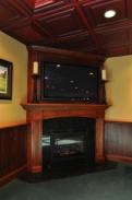 A Drumm Design Remodel specialty the corner fireplace with BIG Screen TV